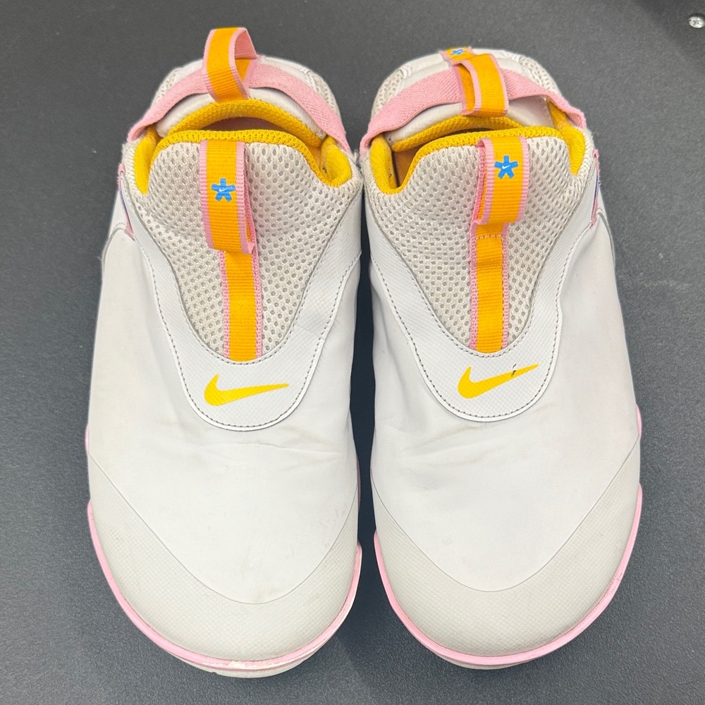 Nike women’s  Slip-On Sneakers in White with Yellow & Pink Accents